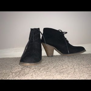 Heeled black booties